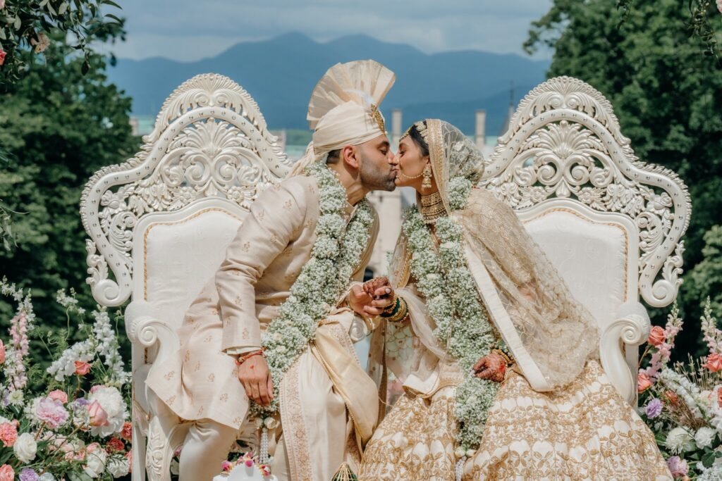 Bride and groom seated at the mandap