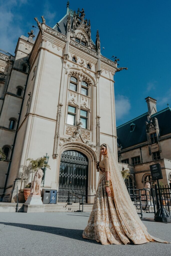 Bride and groom in front of Biltmore House