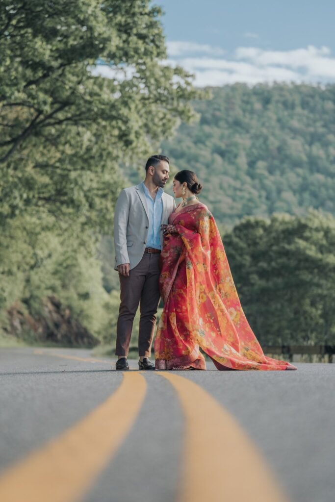 Couple standing on a winding mountain road