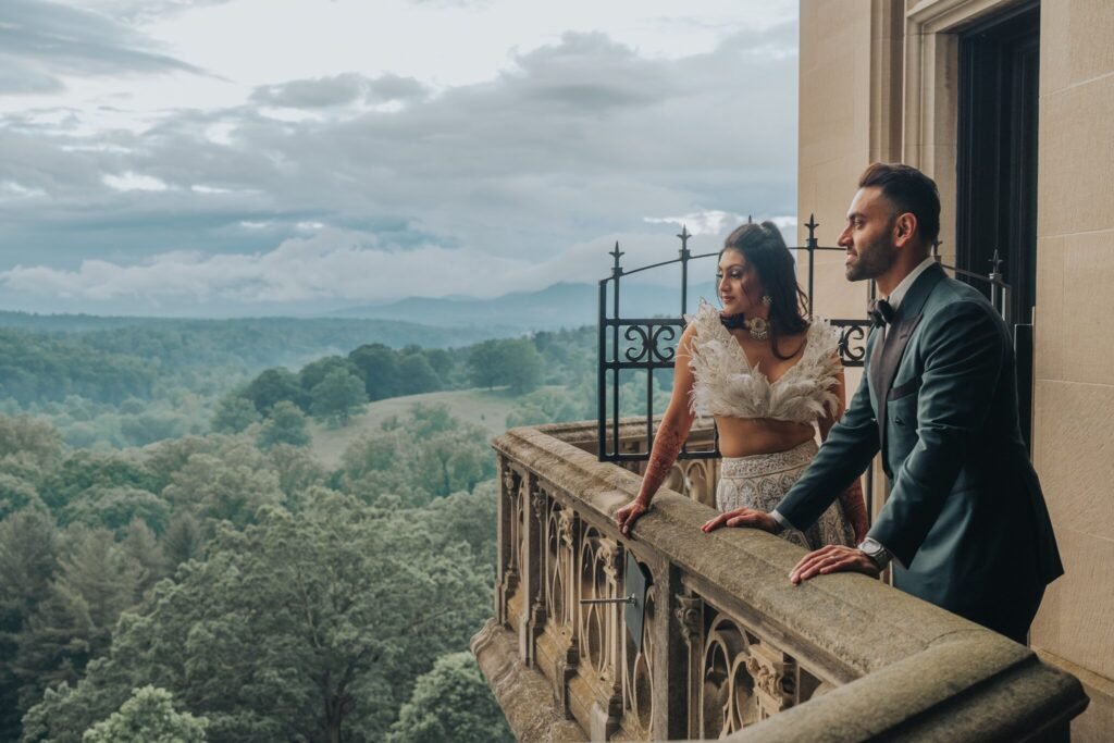 Couple on a stone terrace overlooking the mountains